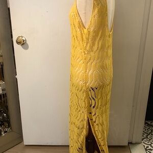 St Tropez yellow crochet maxi side slit dress.